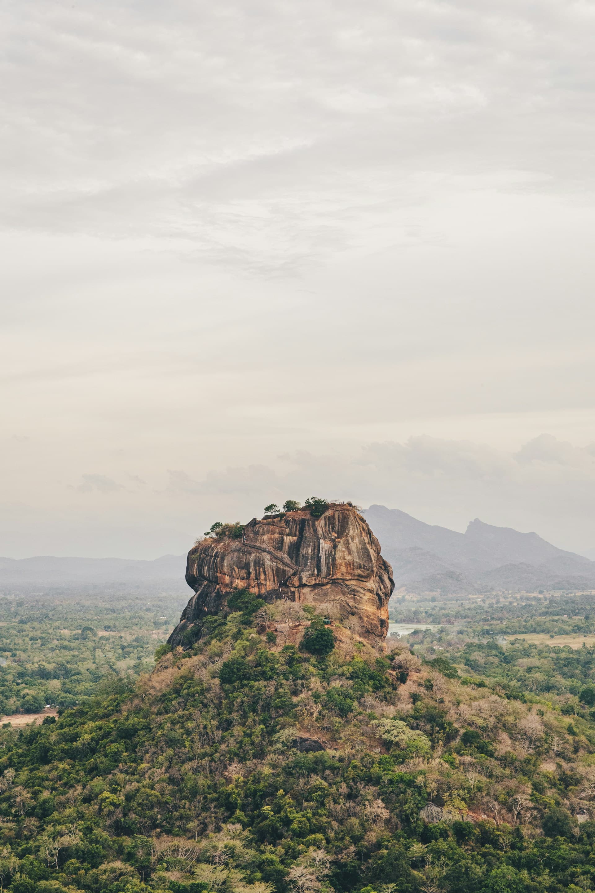 The rock fortress of Sigiriya rising above the forest
